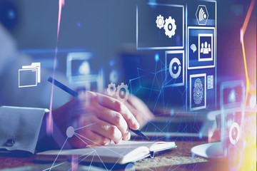 Man writing in office, cloud computer interface