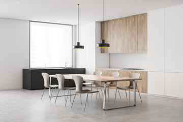 White kitchen corner, gray countertops and table