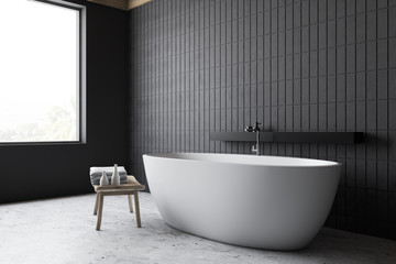 Fototapeta na wymiar Loft bathroom corner with gray bathtub