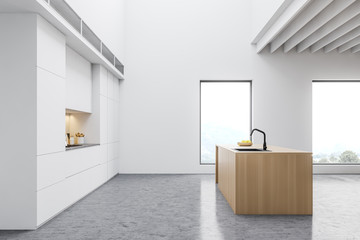 Spacious white kitchen with wooden island