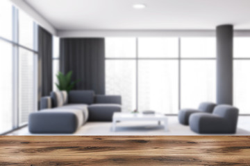 Table in blurry gray living room