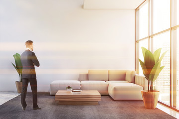 Businessman in white office lounge