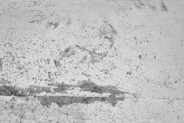 Close-up of White cement crack wall and peeled paint caused by water and sunlight. Peel wall of White house paint with black stain. Black and White of Texture background.
