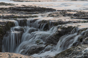 Water flowing on the rock formation.