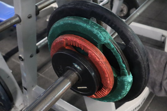 Heavy weights fitness room dumbels and bar.