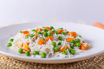 Basmati rice with carrots and green peas.