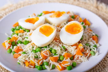 Basmati rice with eggs, carrots and green peas.