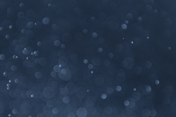 abstract sparkle bokeh light effect with navy blue background