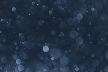 abstract sparkle bokeh light effect with navy blue background