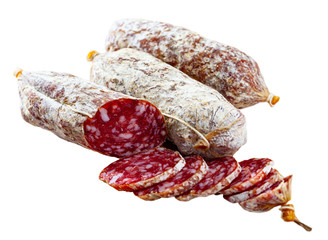 Italian cacciatori salami sausages cut in slices on a wooden desk, closeup