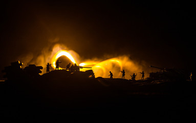 War Concept. Military silhouettes fighting scene on war fog sky background, World War German Tanks Silhouettes Below Cloudy Skyline At night. Attack scene. Armored vehicles and infantry.