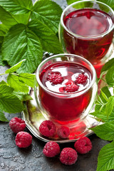 Juice of fresh raspberries served with berry  in glass