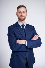 portrait of young handsome businessman over white