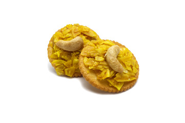 Crispy dried cracker topping by durian with cashews isolated on white background. The main ingredient is the king of fruits in Thailand and world famous.