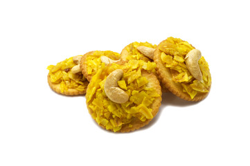 Crispy dried cracker topping by durian with cashews isolated on white background. The main ingredient is the king of fruits in Thailand and world famous.