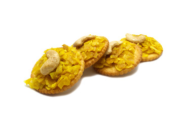 Crispy dried cracker topping by durian with cashews isolated on white background. The main ingredient is the king of fruits in Thailand and world famous.