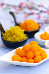 hai desserts. Tong Yord (Round Egg Yolk Tart) Egg yolk, sugar, and flower water are boiled in sugar syrup and formed into round balls.
