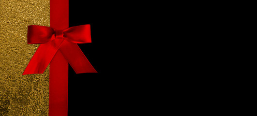 red ribbon and bow on black background