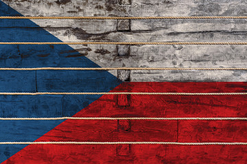 National flag  of Czech. on a wooden wall background. The concept of national pride and a symbol of...