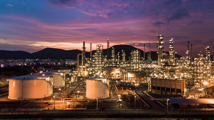 Fototapeta na wymiar Aerial view oil storage tank with oil refinery background, Oil refinery plant at twilight.