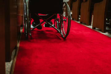 Disabled man on a wheelchair at church in Sunday morning.Concept for Disabled people worship and...