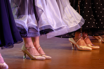 Girls in ball gowns at dance competition