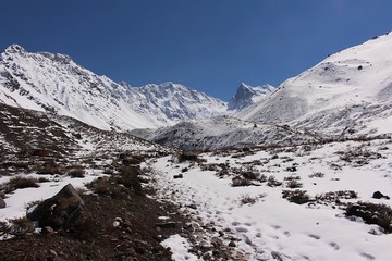 Obraz premium Valley among snowy mountains in Cajón del Maipo, central Andes of Chile.