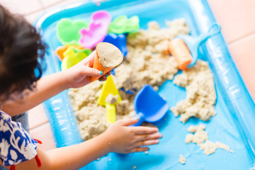 Close up Child's hand with sand playing sand at home.Concept for Executive Functions on kid when play sand.