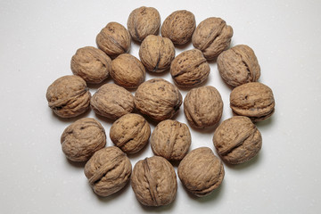 Walnut heap closeup. Vegan food. Concept of healthy food.