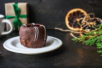 chocolate cake with filling, festive table setting (coffee, gifts, sweets) menu concept. food background. top view. copy space