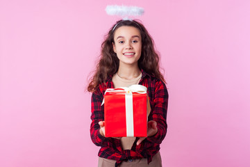 Holiday discounts. Portrait of charming angelic teenage girl with curly brunette hair and toy halo...