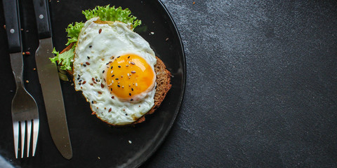 fried eggs in avocado (healthy food, vitamins) menu concept. food background. top view. copy space