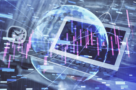 Financial graph colorful drawing and table with computer on background. Double exposure. Concept of international markets.