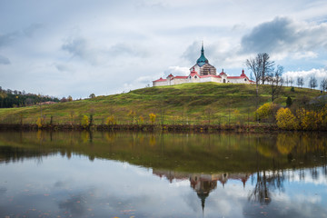 The pilgrimag church on Zelena Hora - Green Hill - Monument UNESCO. St. Jan Nepomucky Church panorama in autumn scene with reflection in the lake water.