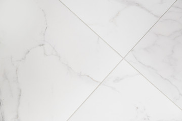 Ceramic tile with marble texture. Diagonal layout of tiles.