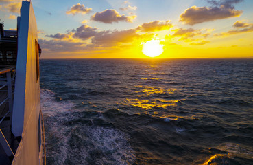 Vacation and traveling on luxury cruise ship liner with beautiful panoramic sunrise or sunset over...