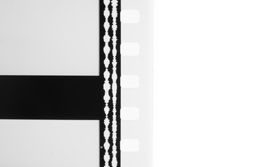 35 mm film strip detail with optical movie sound tracks cinema background