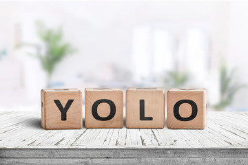 Yolo abbreviation sign in a bright living room