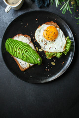 avocado sandwich, healthy food (bread toast snack) menu concept. food background. top view. copy space