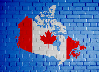 Canada map country silhouette in national Canadian flag colors and with maple leaf on the blue...