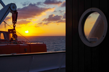Vacation and traveling on luxury cruise ship liner with beautiful panoramic sunrise or sunset over...