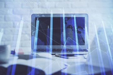 Stock market graph and table with computer background. Double exposure. Concept of financial analysis.