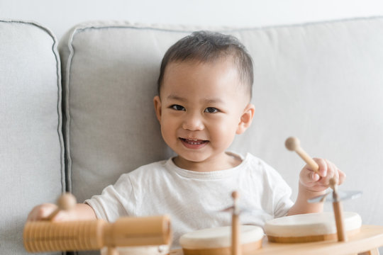 Little Baby Drummer Boy Playing And Hitting The Drum Set At Home.Asian Boy Playing And Singing Happy Moment In Music Lesson Time.Child Development And Executive Function In Child Concept.