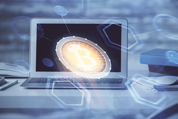 Double exposure of blockchain theme hologram and table with computer background. Concept of bitcoin...