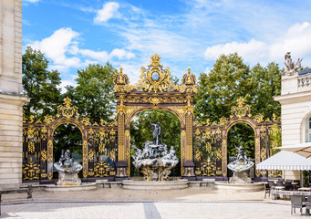 The fountain of Neptune in the Rococo style and the gilded wrought iron portico in the north-west...