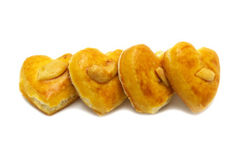 Cashew nut or Singapore cookies of heart shape isolated on white background for valentine's day or other celebration element concept design.