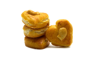 Cashew nut or Singapore cookies of heart shape isolated on white background for valentine's day or other celebration element concept design.