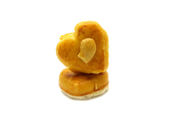 Cashew nut or Singapore cookies of heart shape isolated on white background for valentine's day or other celebration element concept design.