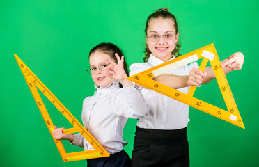 Pupil cute girls with big rulers. STEM school disciplines. math lesson. Education and knowledge....