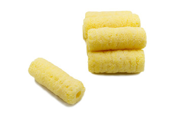 Handful of sweet crunchy corn sticks, snacks isolated on white background.